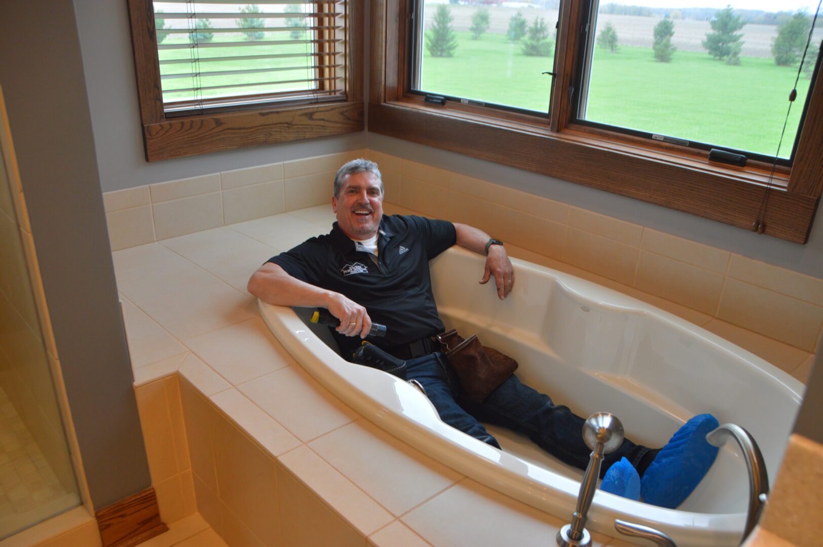A man sitting inside the bathtub